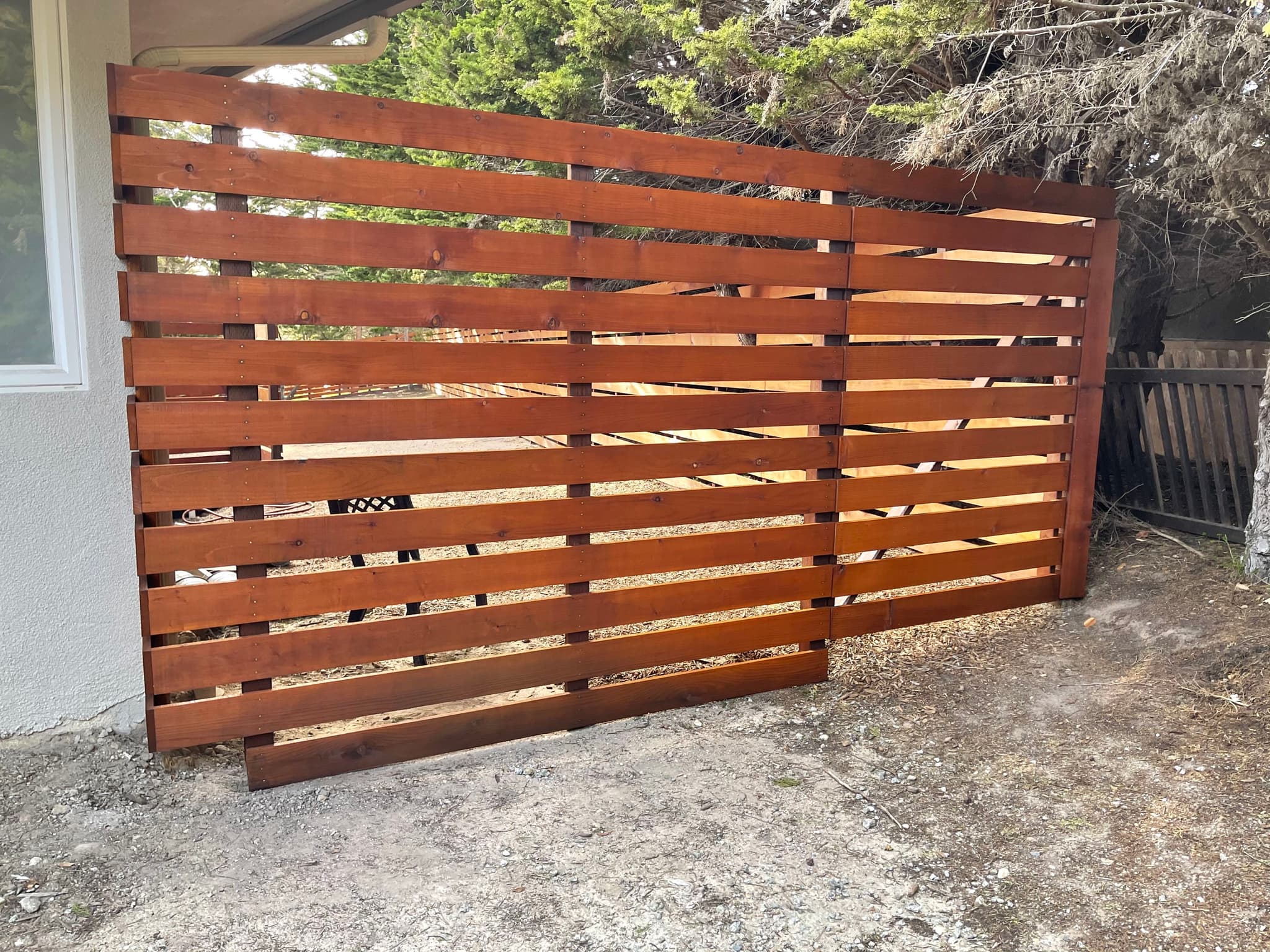 WOOD PRESERVATIVE STAIN FINISH ON CEDAR FENCE