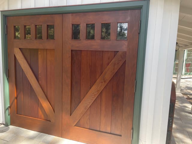 FULL EXTERIOR PAINTING AND WOOD PRESERVATIVE STAIN ON A GARAGE DOOR